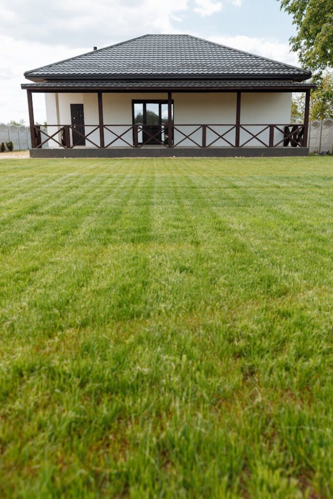 pexels-photo-8469933 A modern house with a large freshly mowed lawn ideal for real estate or gardening themes.